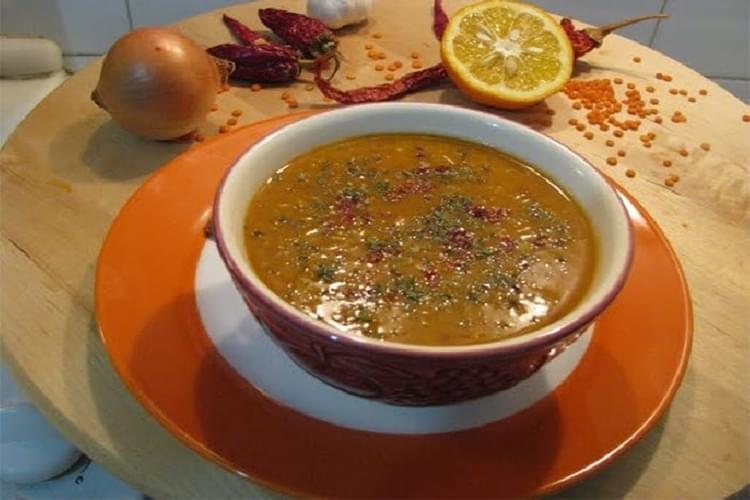 Woman taking a picture with the Dersim Eye skyline.